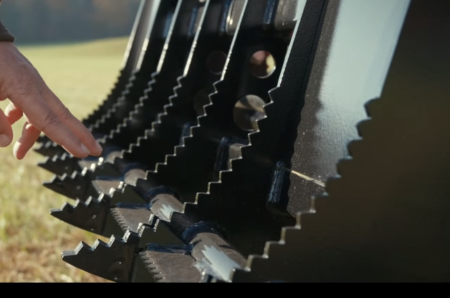 Close-up of serrated AR450 tines on Compact Root Rake Grapple
