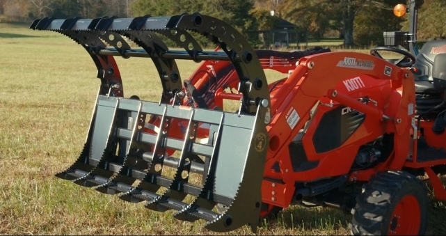 Compact Root Rake Grapple open on Kioti compact tractor loader