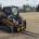 XTREME DUTY skid steer pallet forks mounted on a John Deere compact track loader